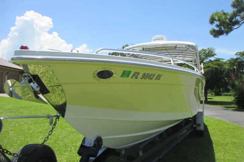 Slide: The Image of 2007 Marlago FS 35 Cuddy boat on trailer, sunny day, green lawn background. - 7