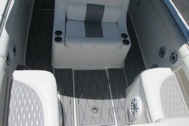 Slide: The Image of 2007 Marlago FS 35 Cuddy interior with cushioned seating and marine speakers. - 23