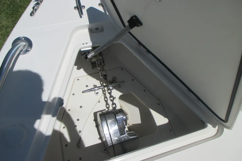 Slide: The Image of Anchor compartment of 2007 Marlago FS 35 Cuddy boat with chain and latch. - 27