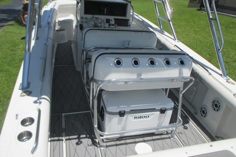 Slide: The Image of 2007 Marlago FS 35 Cuddy boat interior with seating and Igloo cooler. - 12