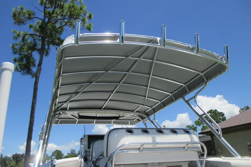 Slide: The Image of 2007 Marlago FS 35 Cuddy boat with sleek canopy and clear blue sky background. - 29