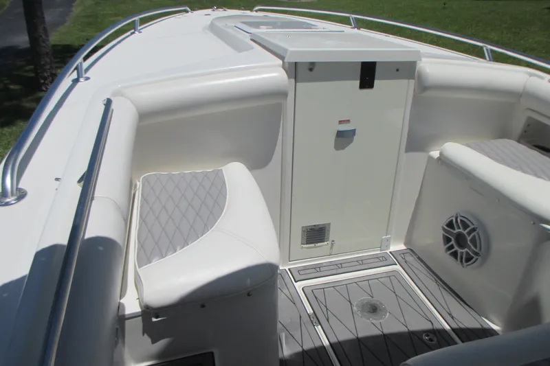 Slide: The Image of 2007 Marlago FS 35 Cuddy interior with cushioned seating and storage compartment. - 21