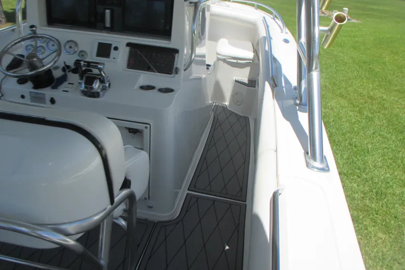 Slide: The Image of 2007 Marlago FS 35 Cuddy boat interior with steering console and seating. - 17