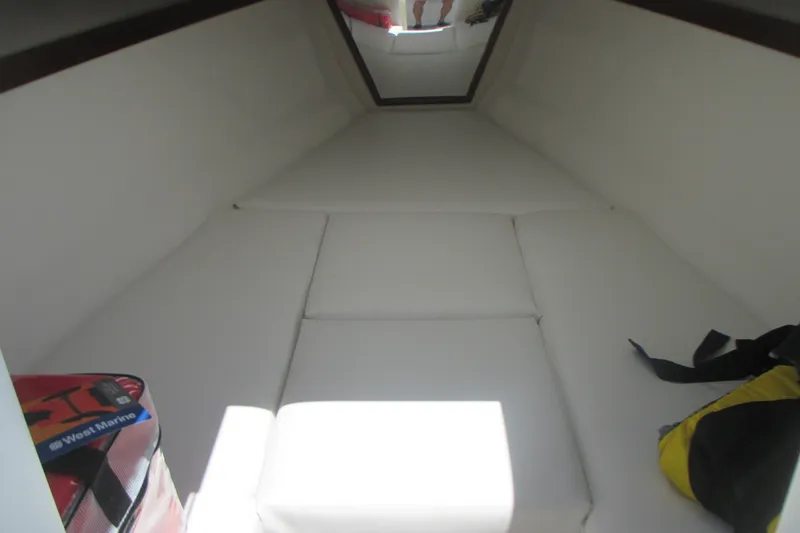 Slide: The Image of 2007 Marlago FS 35 Cuddy cabin interior with cushions and storage bags. - 24