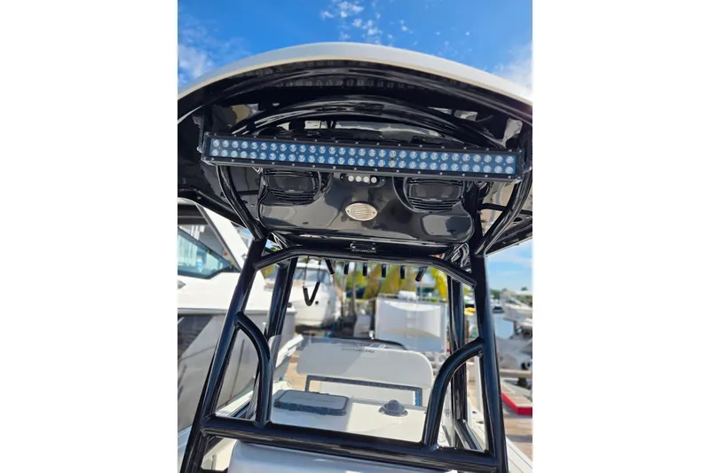 Slide: The Image of 2025 Sea Pro 225FLX Sandbar boat with T-top and LED light bar. - 22