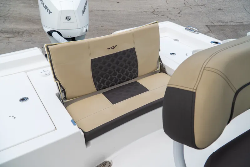 Slide: The Image of 2021 Tidewater 2300 Carolina Bay boat seating with beige and black upholstery. - 33