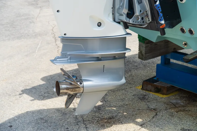 Slide: The Image of Outboard motor of 2021 Tidewater 2300 Carolina Bay boat on a stand. - 48