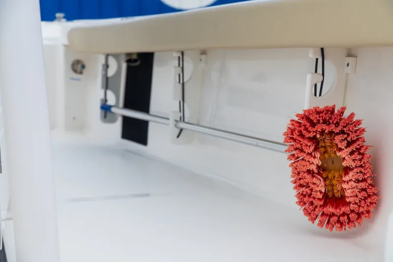 Slide: The Image of 2021 Tidewater 2300 Carolina Bay boat interior with mounted cleaning brush. - 29
