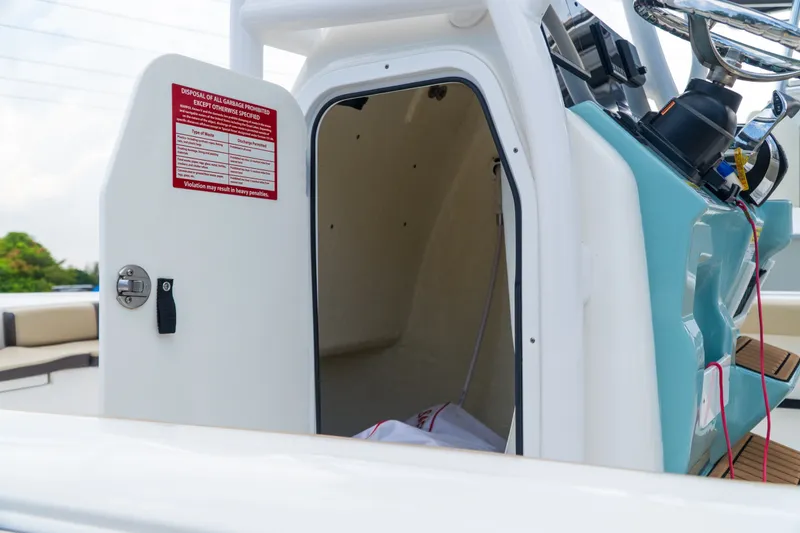 Slide: The Image of 2021 Tidewater 2300 Carolina Bay boat console with open storage compartment. - 16
