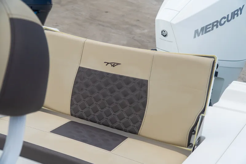 Slide: The Image of 2021 Tidewater 2300 Carolina Bay boat seat with Mercury engine in background. - 34