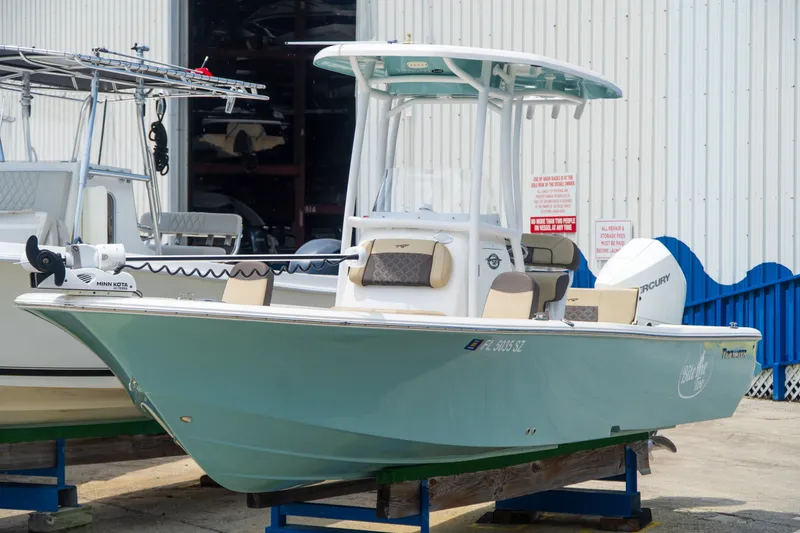 Slide: The Image of 2021 Tidewater 2300 Carolina Bay boat displayed outdoors on a stand. - 44