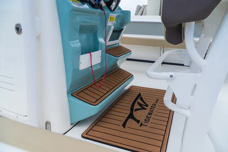 Slide: The Image of 2021 Tidewater 2300 Carolina Bay boat interior with branded non-slip flooring. - 15