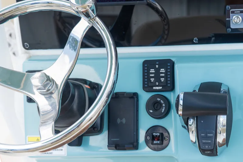 Slide: The Image of Steering wheel and controls of 2021 Tidewater 2300 Carolina Bay boat. - 20