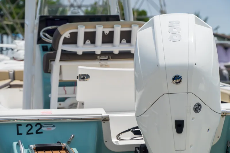 Slide: The Image of 2021 Tidewater 2300 Carolina Bay boat with powerful outboard motor, rear view. - 45