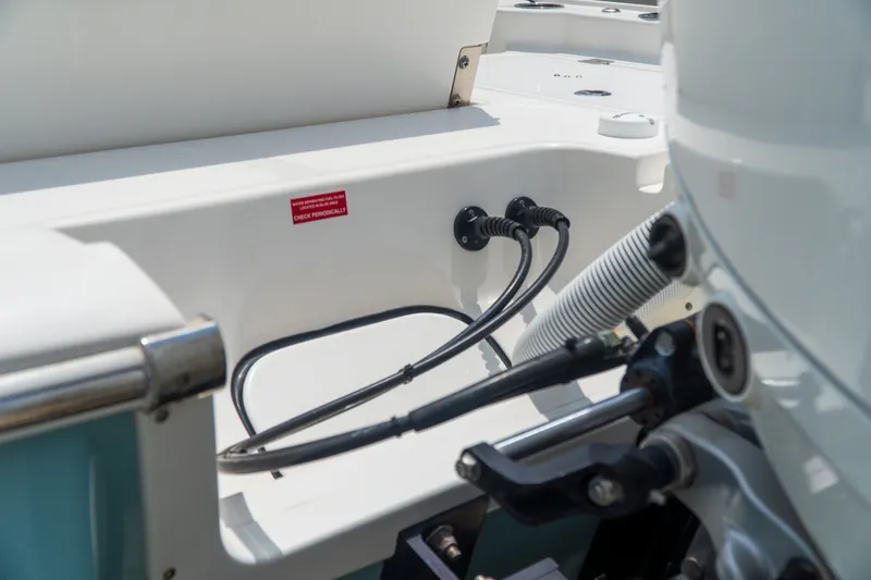 Slide: The Image of 2021 Tidewater 2300 Carolina Bay boat engine compartment with cables and hoses. - 50