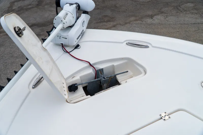 Slide: The Image of 2021 Tidewater 2300 Carolina Bay boat anchor compartment with Minn Kota trolling motor. - 24