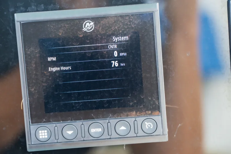 Slide: The Image of Display screen showing 76 engine hours on a 2021 Tidewater 2300 Carolina Bay boat. - 40