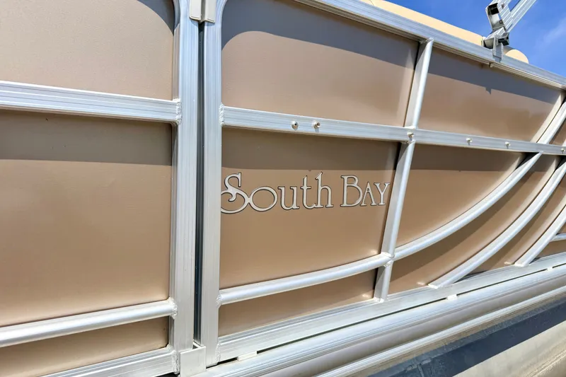 Slide: The Image of 2013 South Bay 417 CR pontoon boat with beige paneling and silver trim. - 20