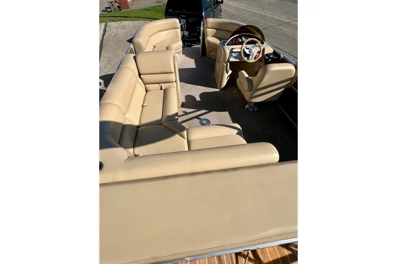 Slide: The Image of 2013 South Bay 417 CR pontoon boat with beige seating and steering console. - 31