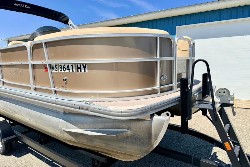 Slide: The Image of 2013 South Bay 417 CR pontoon boat on trailer, parked outdoors. - 6