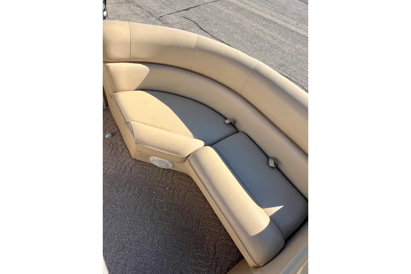 Slide: The Image of Beige seating on 2013 South Bay 417 CR boat, featuring curved design and speaker. - 13
