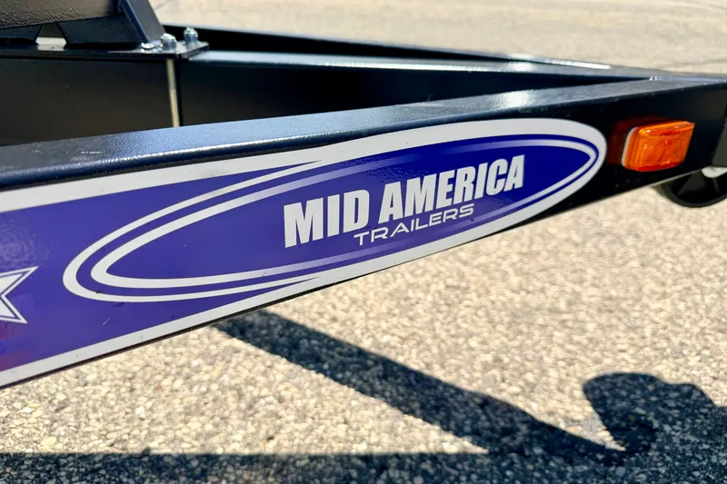 Slide: The Image of Close-up of Mid America Trailers logo on a 2013 South Bay 417 CR trailer. - 79
