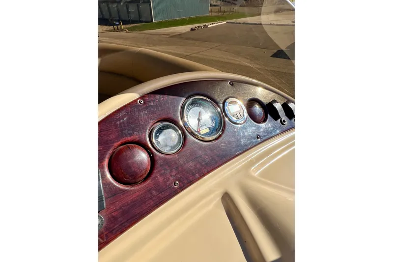 Slide: The Image of Dashboard of a 2013 South Bay 417 CR boat with wooden paneling. - 20