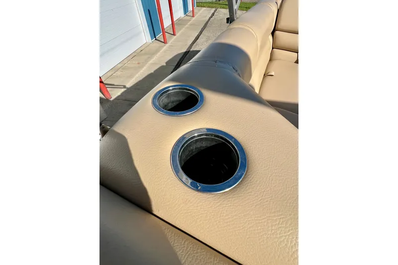Slide: The Image of Beige leather seating with cup holders on a 2013 South Bay 417 CR boat. - 32