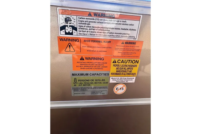Slide: The Image of Warning labels on 2013 South Bay 417 CR boat, highlighting safety and capacity information. - 23