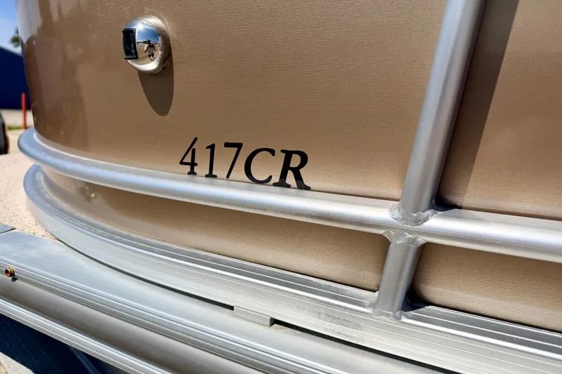 Slide: The Image of Close-up of 2013 South Bay 417 CR boat model name on metallic surface. - 22