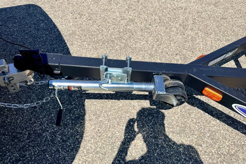 Slide: The Image of Trailer hitch and wheel assembly on a 2013 South Bay 417 CR boat trailer. - 72