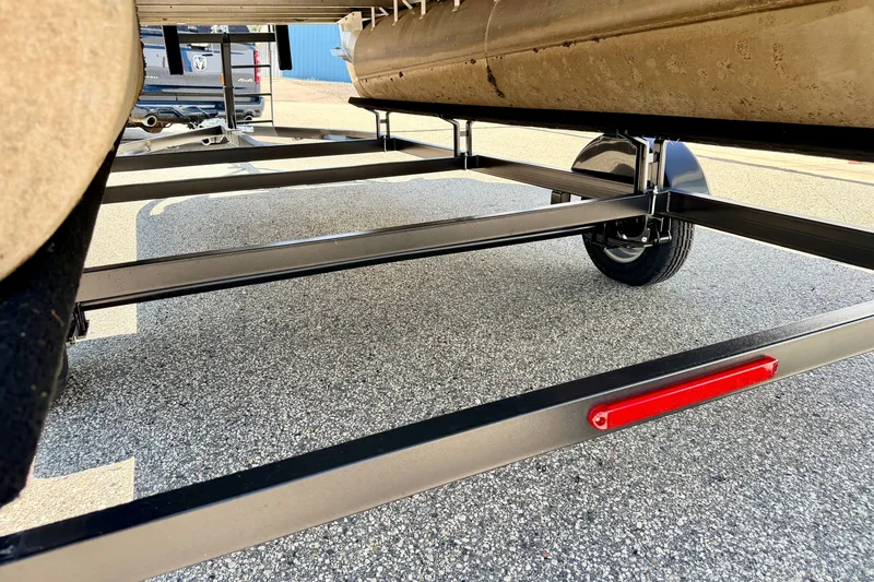 Slide: The Image of Trailer frame of a 2013 South Bay 417 CR pontoon boat on pavement. - 76