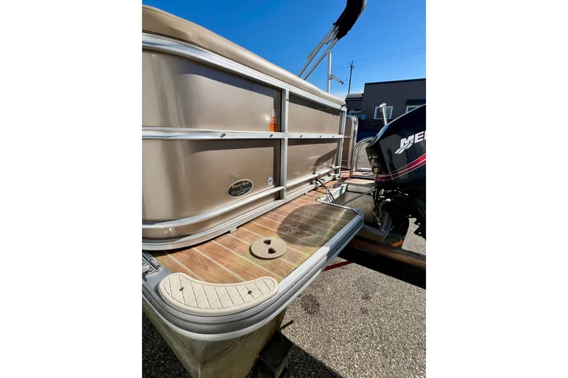 Slide: The Image of 2013 South Bay 417 CR pontoon boat with Mercury outboard motor, docked on a sunny day. - 55