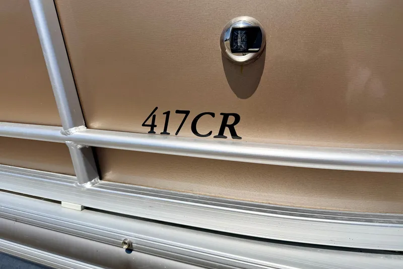 Slide: The Image of 2013 South Bay 417 CR boat exterior with model number displayed. - 12