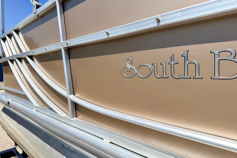 Slide: The Image of 2013 South Bay 417 CR pontoon boat, close-up of side panel and logo. - 13