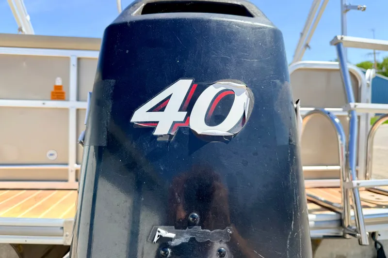 Slide: The Image of Close-up of a 40 HP outboard motor on a 2013 South Bay 417 CR boat. - 16