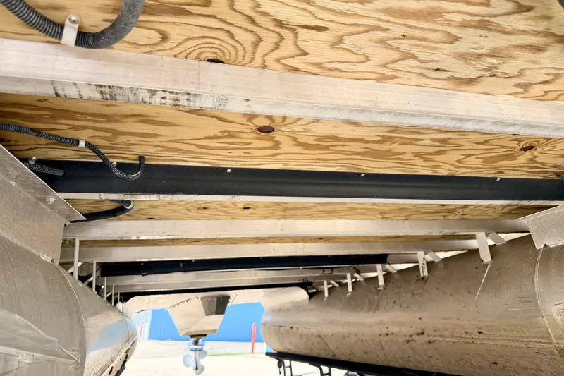 Slide: The Image of Underneath view of a 2013 South Bay 417 CR pontoon boat, showcasing structural details. - 71