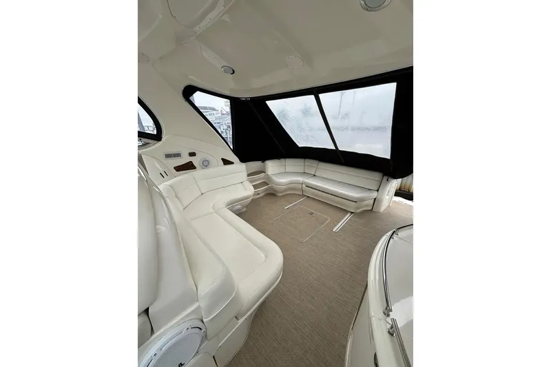 Slide: The Image of Luxurious interior of 2003 Sea Ray 550 Sundancer yacht with plush seating. - 9