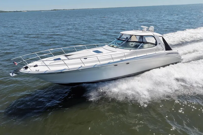 Slide: The Image of 2003 Sea Ray 550 Sundancer cruising on open water, showcasing sleek design and performance. - 1