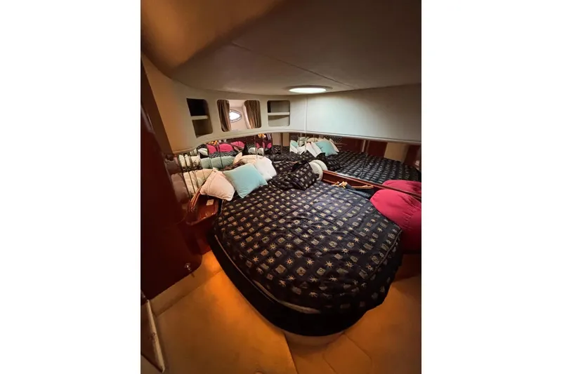 Slide: The Image of Luxurious cabin interior of 2003 Sea Ray 550 Sundancer yacht with cozy bedding. - 18