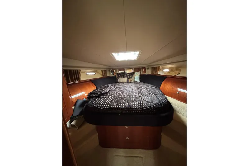 Slide: The Image of Luxurious cabin interior of 2003 Sea Ray 550 Sundancer yacht with cozy bedding. - 19
