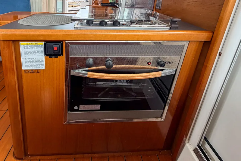 Slide: The Image of Galley kitchen in 2006 Beneteau Swift Trawler 42 with stove and oven. - 4