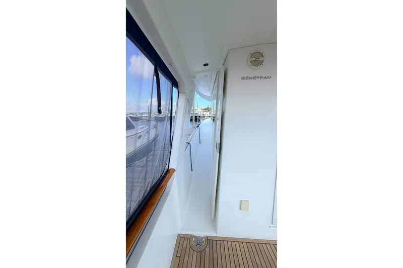 Slide: The Image of Side deck view of 2006 Beneteau Swift Trawler 42 with teak flooring. - 19