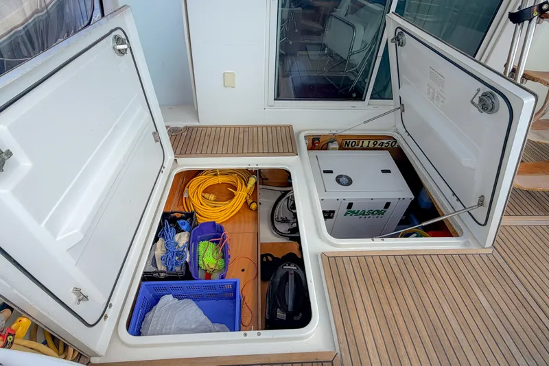 Slide: The Image of Storage compartments on a 2006 Beneteau Swift Trawler 42, featuring ropes and equipment. - 29