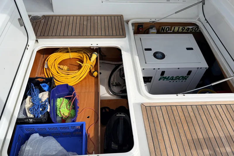 Slide: The Image of Storage compartment of a 2006 Beneteau Swift Trawler 42 with equipment and generator. - 28