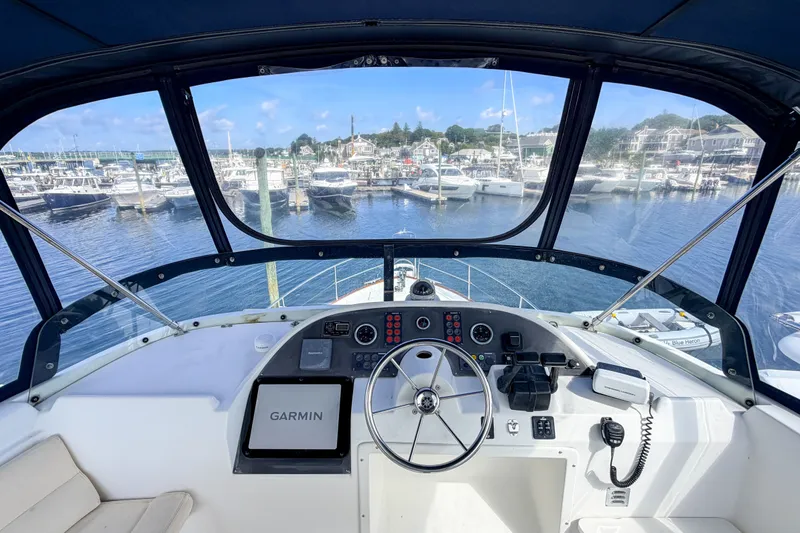 Slide: The Image of Helm of 2006 Beneteau Swift Trawler 42 with Garmin navigation, overlooking marina. - 23