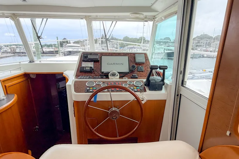 Slide: The Image of Helm of 2006 Beneteau Swift Trawler 42 with Garmin navigation system. - 8