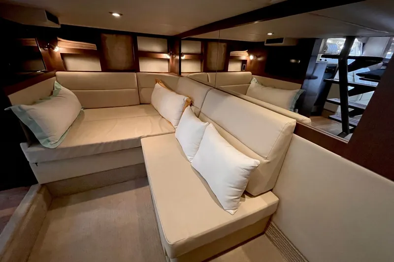Slide: The Image of Luxurious interior of 2015 Sea Ray Sundancer 350 yacht with beige seating and cushions. - 24