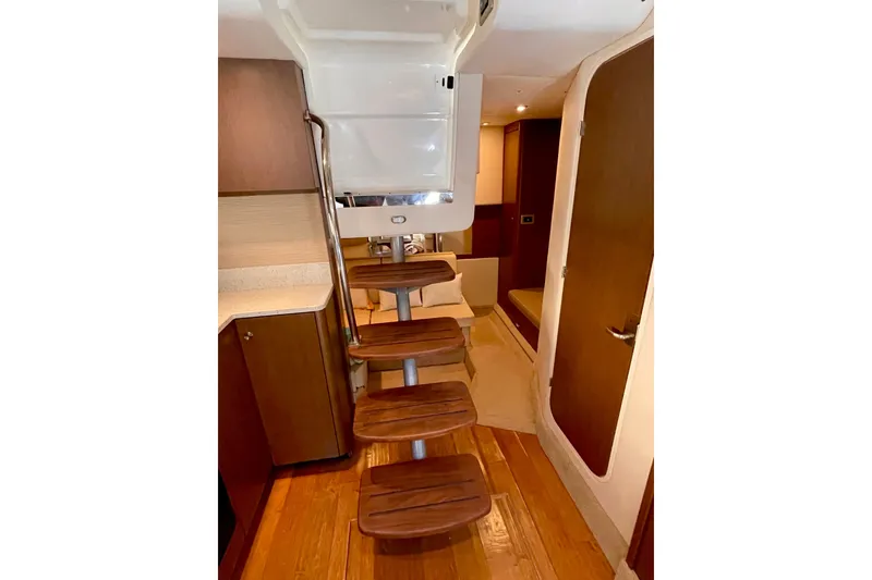 Slide: The Image of Interior of 2015 Sea Ray Sundancer 350 yacht with wooden steps and modern design. - 18