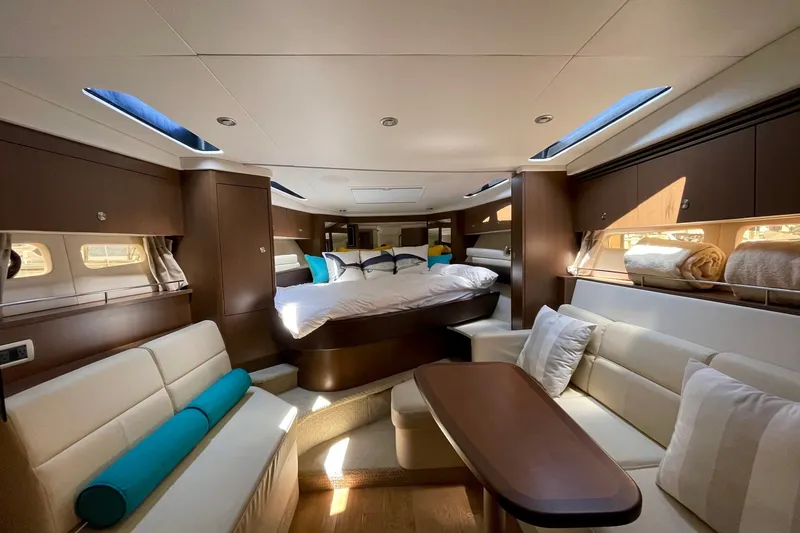 Slide: The Image of Luxurious interior of 2015 Sea Ray Sundancer 350 yacht with elegant seating and bedding. - 21